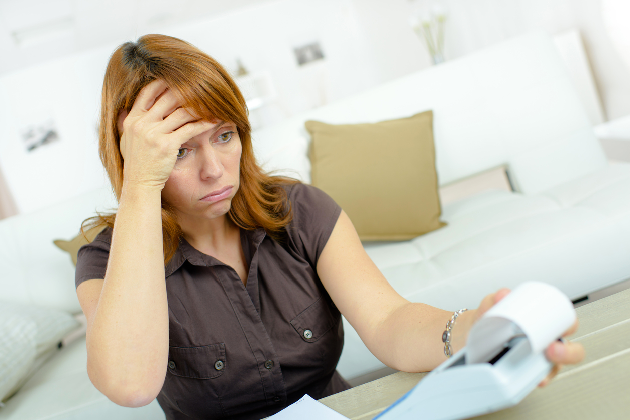 closeup portrait shocked surprised funny looking stressed woman financial crisis